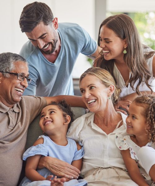 Relax, love and big family happy on sofa smile together in home on the weekend with children. Cheerful and diverse senior grandparents, parents and young kids in Brazil bond in living room